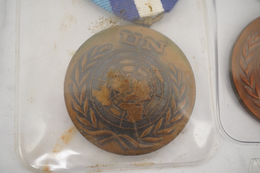 Fourteen United Nations (UN) medals, all with ‘in the service of peace’ to the reverse, including a variety of ribbons for a number of different campaigns (some duplicates). Condition - fair to good.